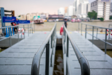 Blur the people waiting passenger ship at the harbor in Bangkok,