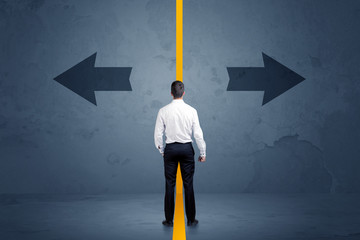 Business person choosing between two options separated by a yell