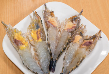 Fresh shrimp for cooking on dish.