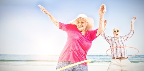 Senior couple doing hula hoop © vectorfusionart