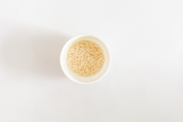rice in white plate on white background