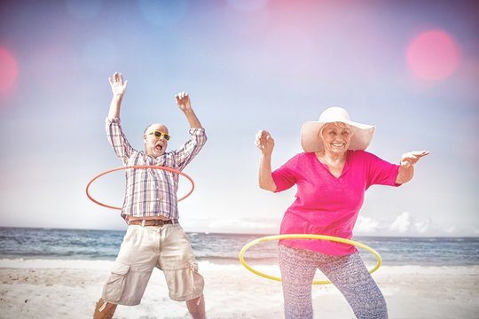 Senior Couple Doing Hula Hoop