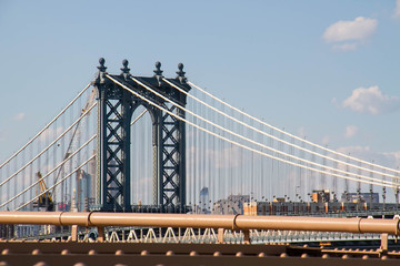 Manhattan bridge and cable with blue sky, New York