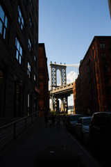 Manhattan bridge and silhouette of building, Brooklyn, New York