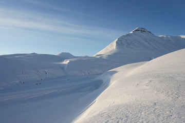 The mountains covered with snow near the Soviet abandoned town Pyramiden (Svalbard).