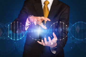 Businessman holding DNA
