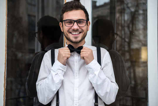 Groom In White Shirt Smiling Near The Window