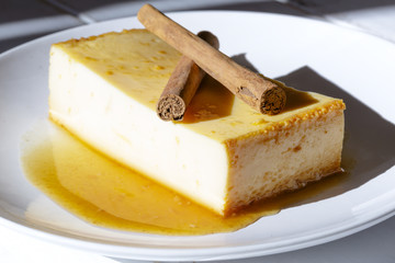 Homemade custard pudding with caramel on dish.