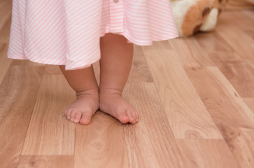 Little girl standing on the floor