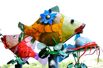Three colorful fishes made of metal