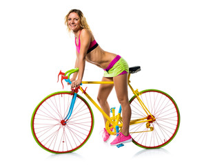Fototapeta na wymiar Beautiful blonde woman with colorful bike