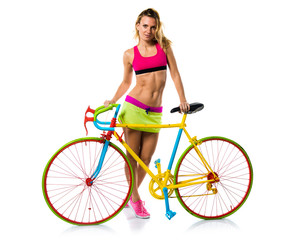 Obraz premium Beautiful blonde woman with colorful bike