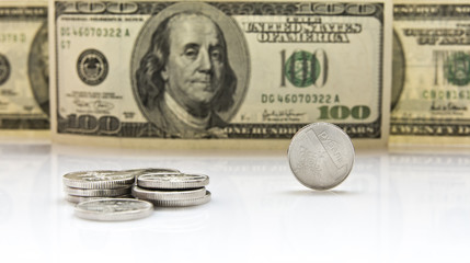 coins on background of banknotes of dollars 