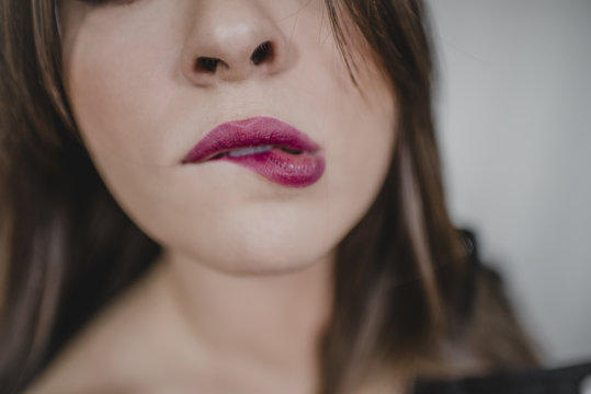 Woman biting her lip