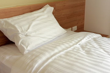 rest, interior, comfort and bedding concept - bed at home bedroom