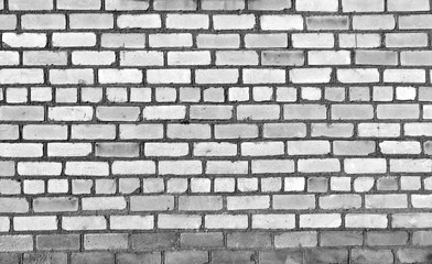 Old black and white brick wall texture.