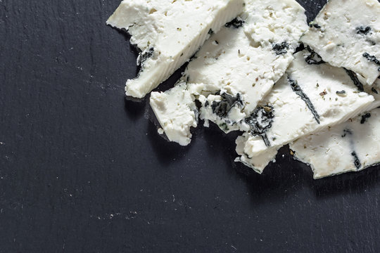 Blue cheese on black back board, french cuisine appetizer.