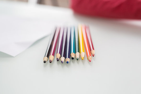 Row of assorted coloured pencils 