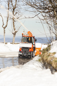 snow blower machine vehicle working  removing  the snow from the