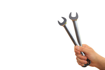 Hand holding spanners on white background