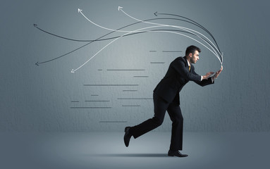 Running businessman with device and hand drawn lines