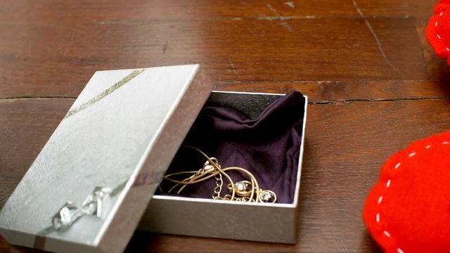 View of beautiful presents in the box and on the handmade heart, steadycam shot
