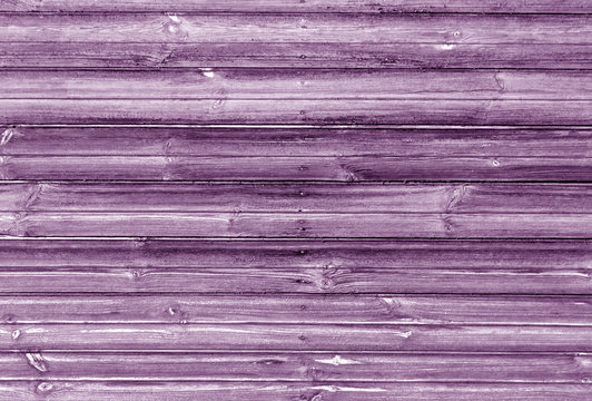 magenta toned wooden wall texture.