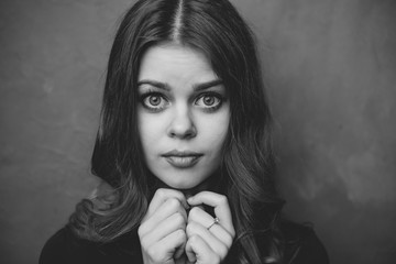 woman with wide open eyes and loose hair