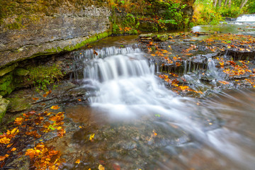 Fototapeta na wymiar Small waterfall (cascades) on river in Estonia