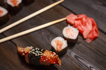 sushi with seafood, ginger and rolls on the table