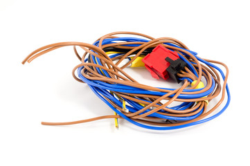 Skein of blue and brown wires on a white background. The red plu