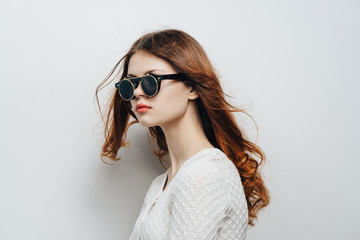 fashionable woman with glasses, side view