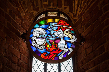 Colorful styled coat of arms on stained glass in Trakai castle, Lithuania