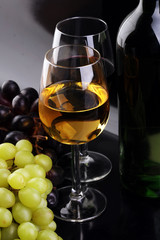 Wine glass and Bottle on black background. Red and white wine