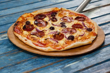 Delicious italian pizza served on pizza peel