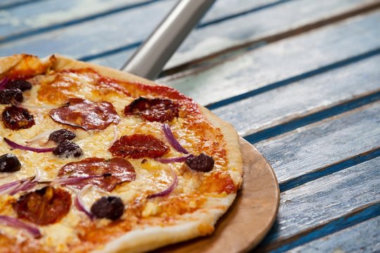 Delicious Italian Pizza Served On Pizza Peel