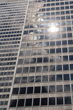 Close up of Financial Buildings mirroring clouds on the sky
