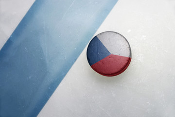 old hockey puck with the national flag of czech republic