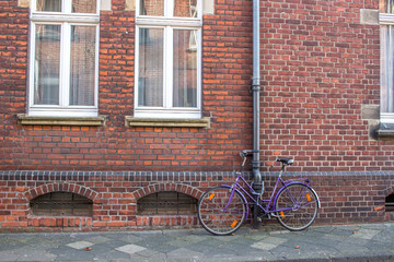 Old Brick wall house with a bike