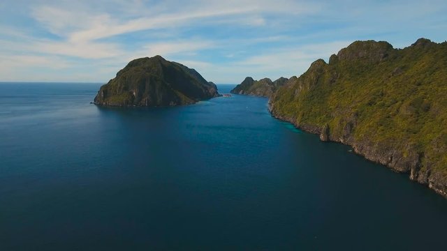 Tropical islands, aerial view. Aerial view: sea and the tropical island. Tropical bay in El Nido. Archipelago El Nido.Sandy beaches of the wild islands. Philippines National Marine Park. Aerial video