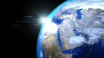 Earth globe from space with sun and clouds, close up, showing Mi