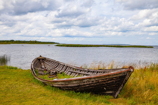 Old abandoned wooden fisher's boat near Baltic sea