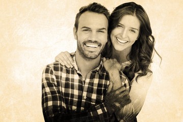 Composite image of portrait of young couple smiling