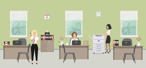 Office room on the day of March 8. The young women are employees at work. There is beige furniture, a copy machine on a window background in the picture. There are vases with flowers on the tables 