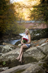High School Senior Girl teenager holding red roses smiling