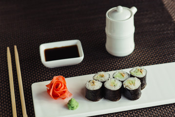 Traditional fresh Japanese sushi rolls on a white plate © maxfotoadobe