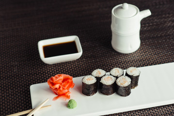 Traditional fresh Japanese sushi rolls on a white plate © maxfotoadobe