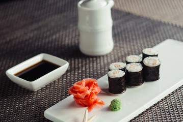 Traditional fresh Japanese sushi rolls on a white plate © maxfotoadobe
