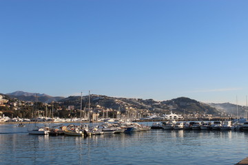 Fototapeta na wymiar Boats, harbour and hills