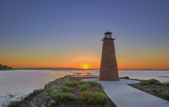 Dawn view over Lake Toho (Lake Tohopekaliga) in Kissimmee Florida including walkway and mini lighthouse. 